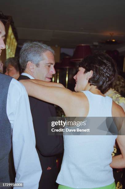 American financier Jeffrey Epstein and British socialite Ghislaine Maxwell attend a birthday party for Michael Caine at The Canteen restaurant in...