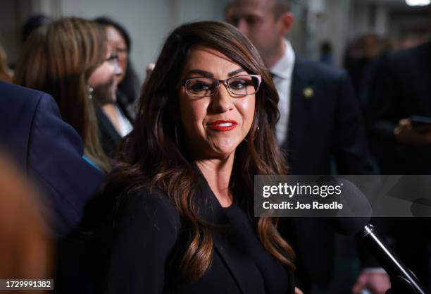 Rep. Lauren Boebert leaves a House Republican caucus meeting where the conference met to vote on a Speaker of House nominee in the Longworth House...