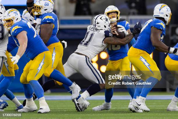 Los Angeles, CA - Los Angeles Chargers Quarterback Justin Herbert is sacked by the Dallas Cowboys Micah Parsons during play at SoFi Stadium on...