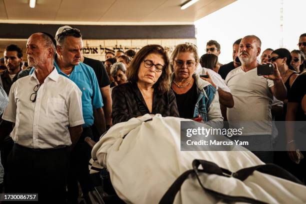 Mirela Ludmir, pays her last respect to her slain son Daniel Levy was killed in the BeÕeri Kibbutz in an unprecedented Hamas assault on communities...