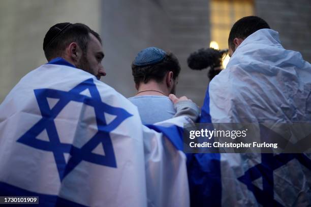 Members of the Jewish community attend a vigil for the victims of the recent attacks in Israel at Central Library, St Peter's Square, on October 11,...