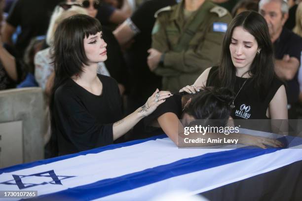 Family, and friends of Yuval Solomon, who was murdered in Kfar Aaz, in Hamas' attack on the Kibbutz, mourn during his funeral on October 17, 2023 in...