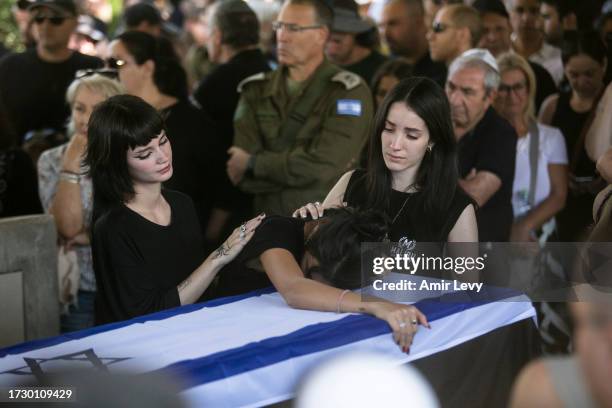 Family, and friends of Yuval Solomon, who was murdered in Kfar Aaz, in Hamas' attack on the Kibbutz, mourn during his funeral on October 17, 2023 in...