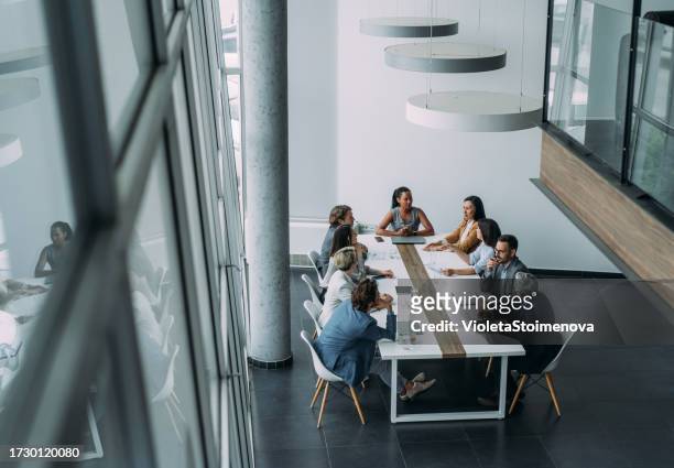business persons on meeting in the office. - directly above office stock pictures, royalty-free photos & images