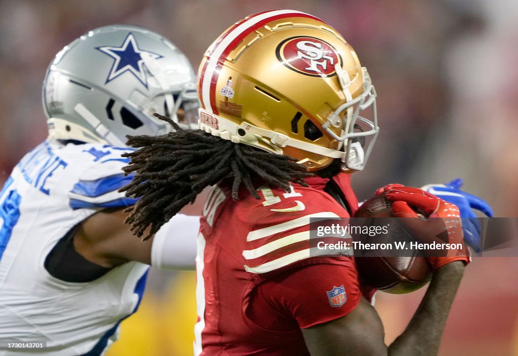 Brandon Aiyuk of the San Francisco 49ers catches a pass over Noah