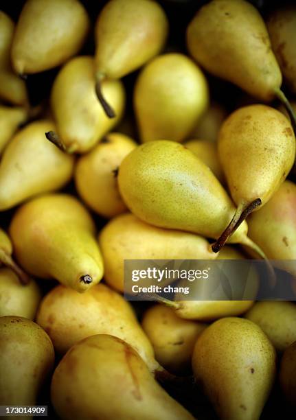 a pile of yellow small ripe pears - pear stock pictures, royalty-free photos & images