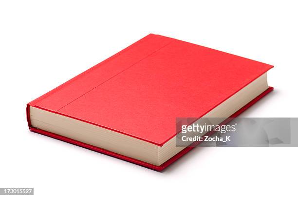 a single red book on a white surface - boek stockfoto's en -beelden