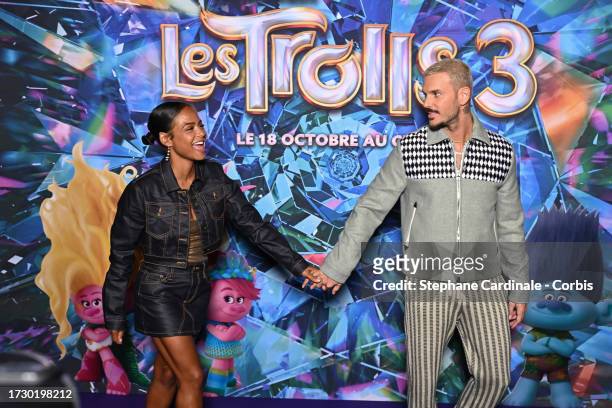 Christina Milian and M. Pokora attend the "Trolls 3" Premiere at Cinema Gaumont Champs-Elysees on October 11, 2023 in Paris, France.