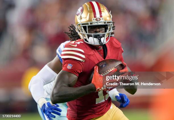 Brandon Aiyuk of the San Francisco 49ers catches a pass over Noah Igbinoghene of the Dallas Cowboys during the third quarter of an NFL football game...