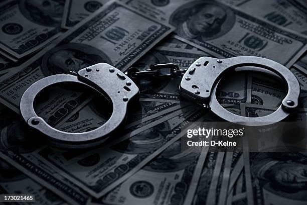 handcuffs - money penalty stock pictures, royalty-free photos & images