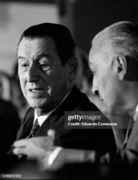 View of former Argentine President Juan Peron as he speaks with his personal secretary Jose Lopez Rega during a press conference at the Confiteria...
