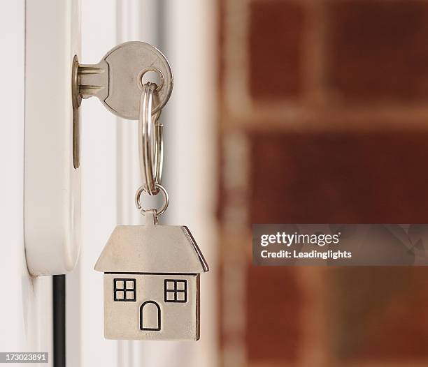 key in the door with copyspace - key ring stock pictures, royalty-free photos & images