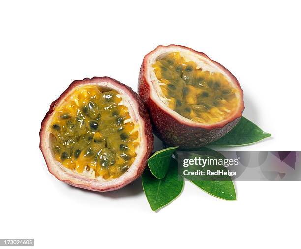 passion fruits with leafs - passievrucht stockfoto's en -beelden