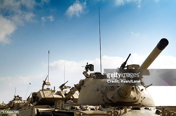 tank convoy with copy space - armored tank stockfoto's en -beelden