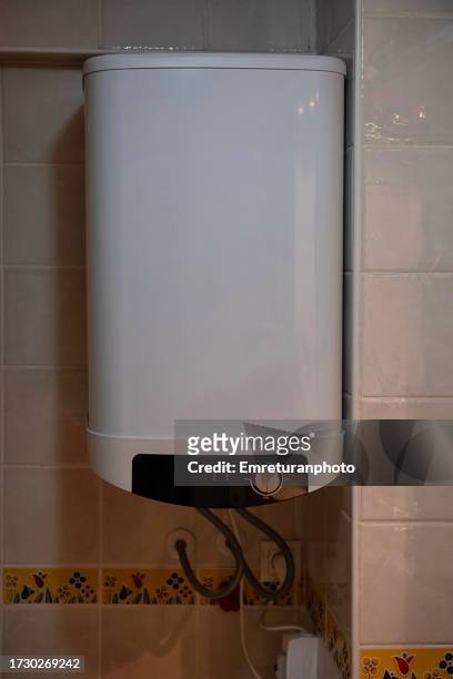 front view of a water heater in the bathroom. - water heater stockfoto's en -beelden