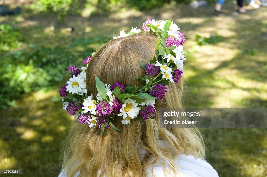 Midsommer girl with flowers in her hair