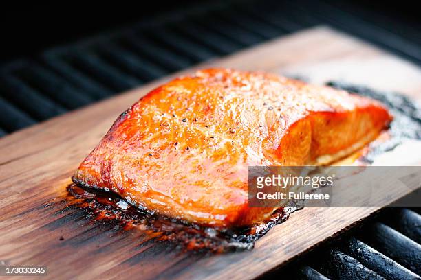cooked cedar plank salmon on wood - smoked stock pictures, royalty-free photos & images