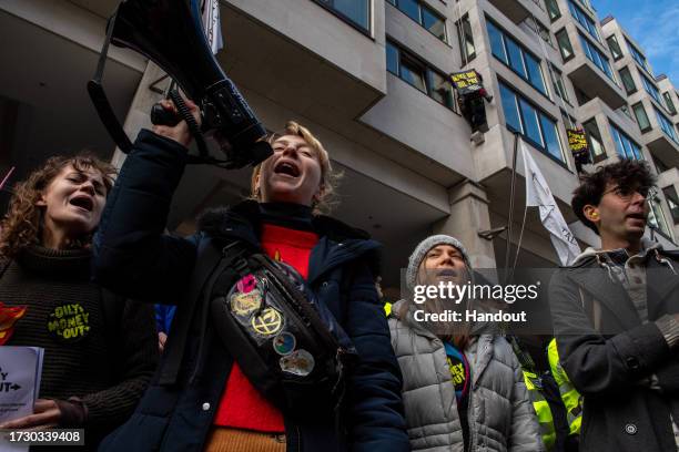 In this handout image provided by Greenpeace, Greta Thunberg joins activists from a variety of groups, including Greenpeace and Extinction Rebellion,...