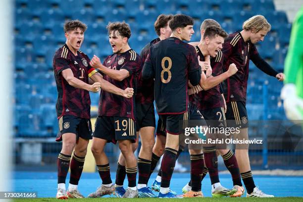 Dzenan Pejcinovic of U19 Germany celebrates with teammates after scoring his team's third goal during during the UEFA Under19 European Championship...