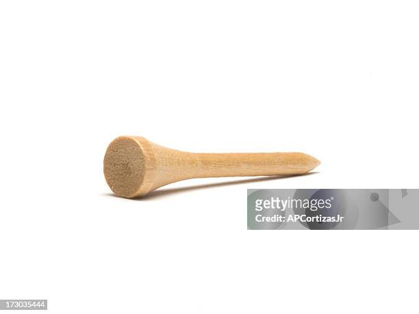 new wooden golf tee isolated against white - golf tee stock pictures, royalty-free photos & images