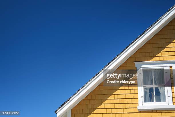 the architectural detail of a roofline on a home - idyllic house stock pictures, royalty-free photos & images