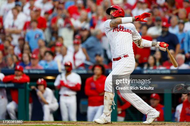 Nick Castellanos of the Philadelphia Phillies hits a solo home run against Bryce Elder of the Atlanta Braves during the third inning in Game Three of...