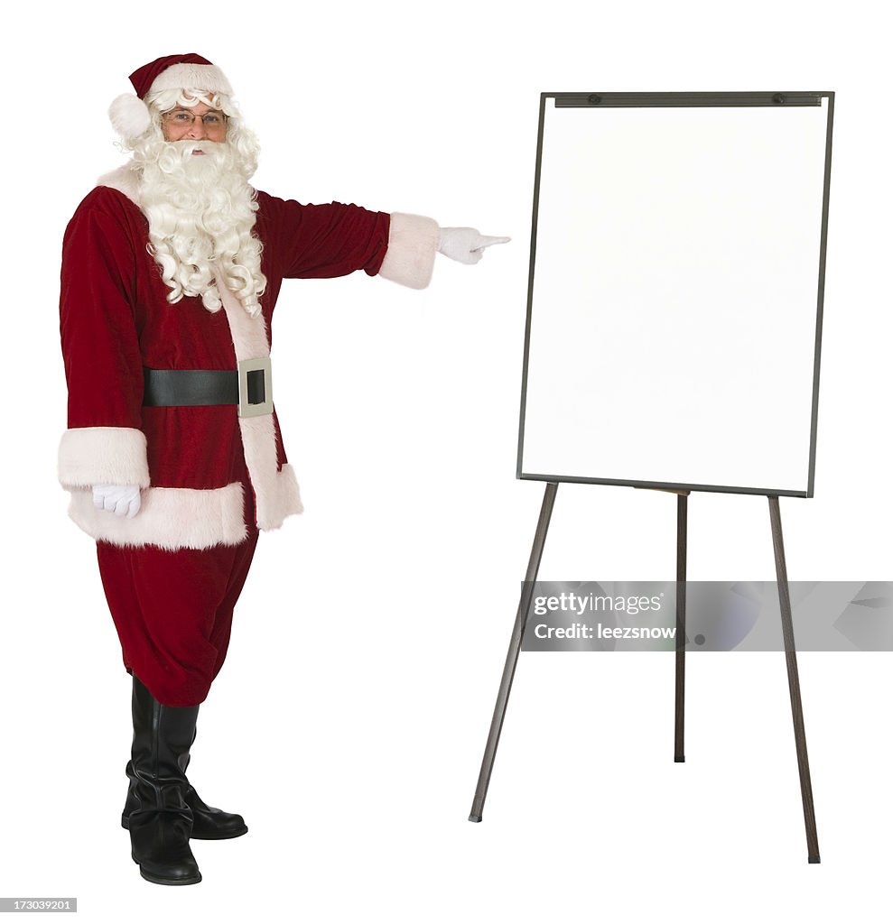 Santa Claus pointing to an isolated whiteboard