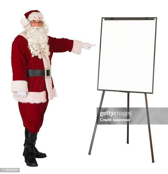 santa claus pointing to an isolated whiteboard - artist easel stock pictures, royalty-free photos & images