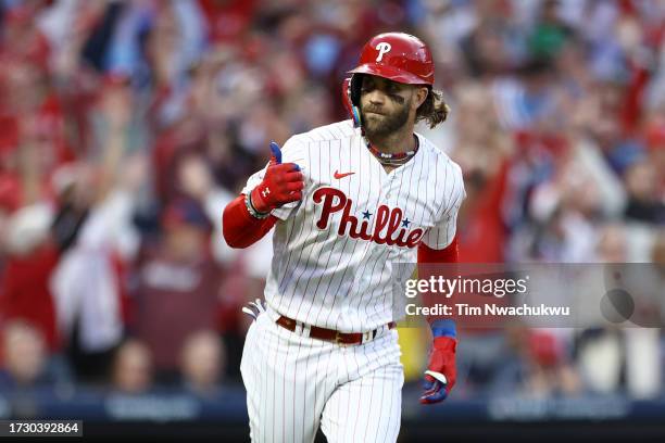 Bryce Harper of the Philadelphia Phillies celebrates after hitting a three run home run against Bryce Elder of the Atlanta Braves during the third...