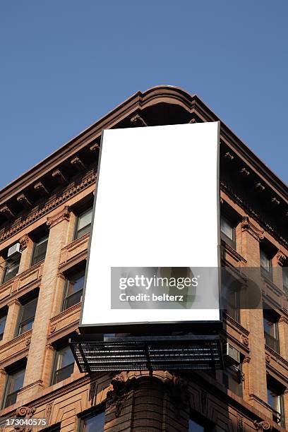 blank billboard on the corner of an apartment block - us blank billboard stockfoto's en -beelden