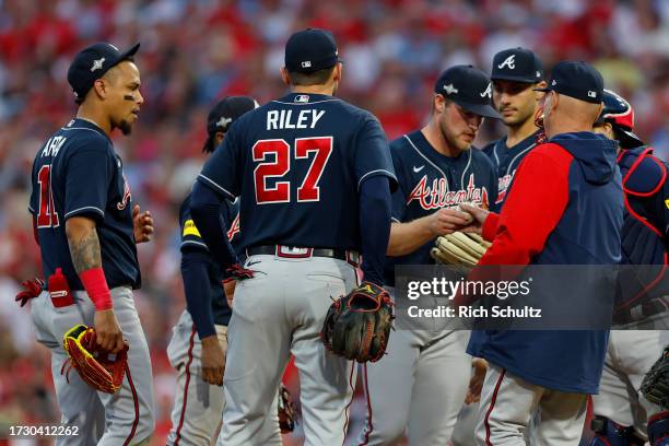 Manager Brian Snitker of the Atlanta Braves takes out Bryce Elder against the Philadelphia Phillies during the third inning in Game Three of the...