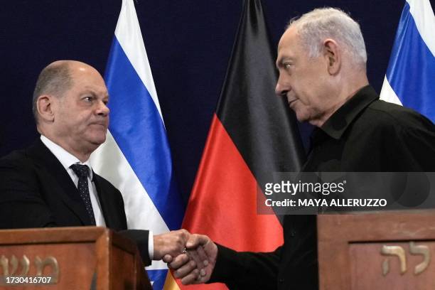 German Chancellor Olaf Scholz and Israeli Prime Minister Benjamin Netanyahu attend a press conference after their meeting in Tel Aviv on October 17,...