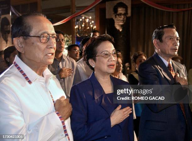 Philippine former presidents Corazon Aquino, widow of assassinated opposition leader Benigno Aquino, and Fidel Ramos with Vice-President Teofisto...