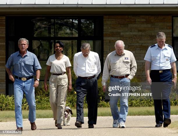 President George W. Bush walks with National Security Advisor Condoleezza Rice, Secretary of Defense Donald Rumsfeld, Vice President Dick Cheney and...