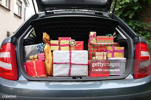 car boot filled with christmas presents - xmas car stock pictures, royalty-free photos & images