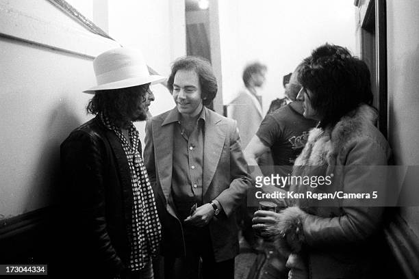 Singers Bob Dylan, Neil Diamond and Ron Wood of the Rolling Stones are photographed backstage of The Last Waltz concert on November 25, 1976 in San...