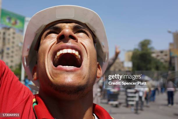 Supporters of former Egyptian President Mohammed Morsi march following Friday prayers in protest over his removal by the Egyptian military on July 5,...