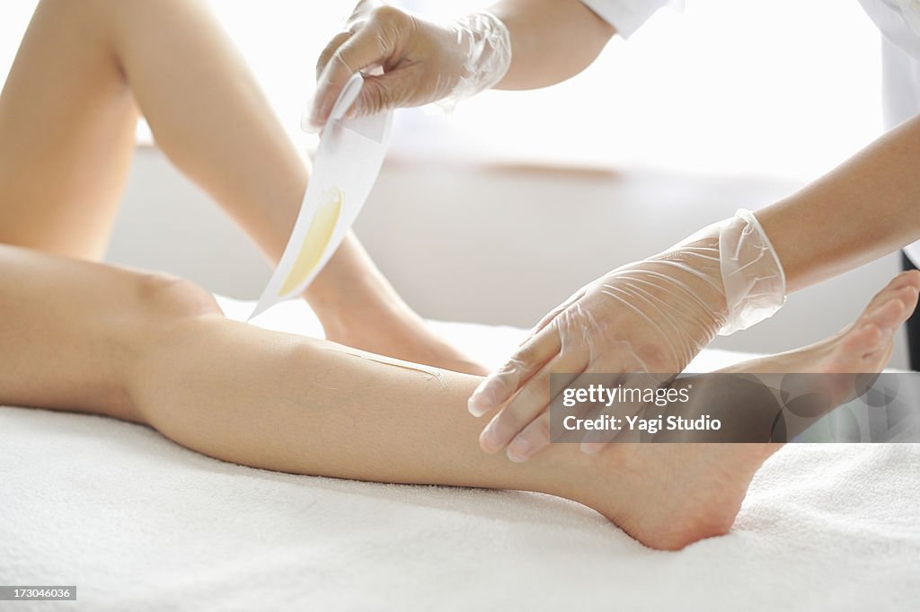 Woman receiving a Brazilian wax hair removal