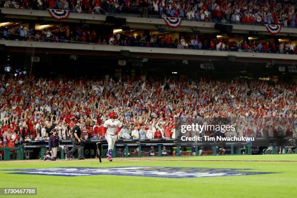 Bryce Harper of the Philadelphia Phillies celebrates after hitting a solo home run against Brad Hand of the Atlanta Braves during the fifth inning in...