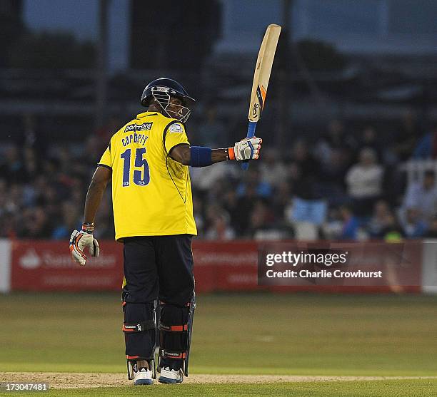 Michael Carberry of Hampshire celebrates his half century during the Friends Life T20 match between Sussex Sharks and Hampshire Royals at The...