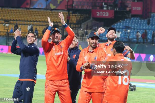 Netherlands team members celebrate their team's win over South Africa during the game during the ICC Men's Cricket World Cup 2023 match between South...