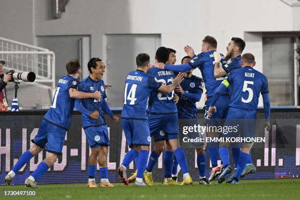 Kazakhstan's midfielder Ramazan Orazov celebrates scoring the 1-2 goal with his team-mates during the UEFA EURO 2024 Group H qualifying football...