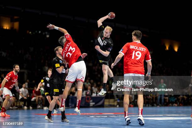 Pierre Paturel of Chambery Savoie HB and Matthes Langhoff of the Fuechsen Berlin during the EHF European League match between Fuechse Berlin and...