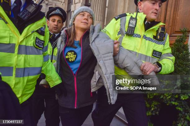 Swedish activist Greta Thunberg is arrested during a protest against fossil fuels outside InterContinental Hotel. Climate protesters gathered outside...
