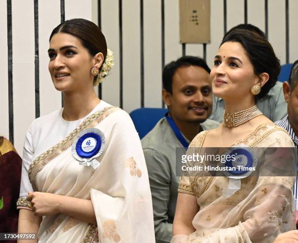 Actress Kriti Sanon,and Alia Bhatt during the 67th national film awards 2021 at Vigyan Bhawan on October 17, 2023 in New Delhi, India.
