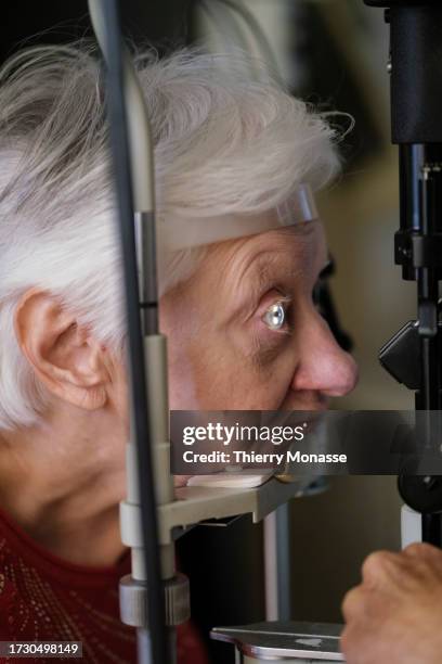 An elderly woman undergoes an ophthalmological examination, on October 17, 2023 in Brussels, Belgium. 20 years after cataract surgery, where her...