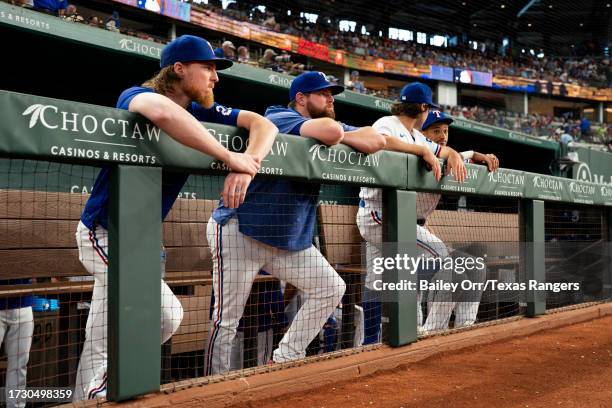 Jon Gray, Jordan Montgomery, Josh Smith and Bubba Thompson of the Texas Rangers look on in the dugout prior to a game against the Chicago White Sox...