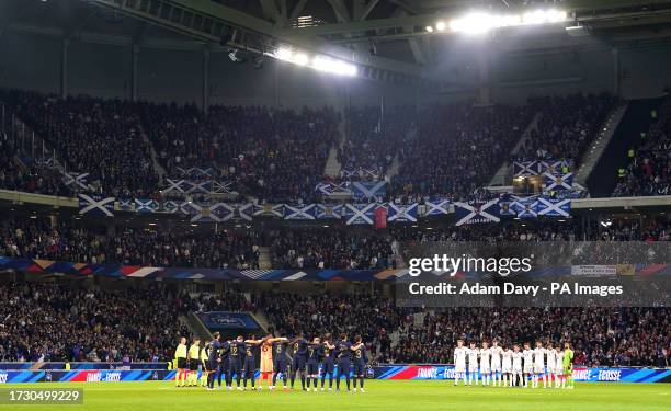 Moment of silence is held by France and Scotland players in memory of the two victims of yesterday's terrorist attack in Brussels ahead of the...