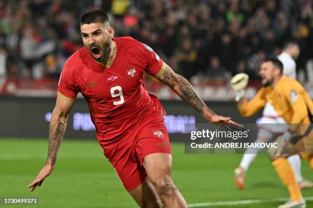 Serbia's forward Aleksandar Mitrovic celebrates after scoring the first team goal during the UEFA Euro 2024 Group G qualifying football match between...
