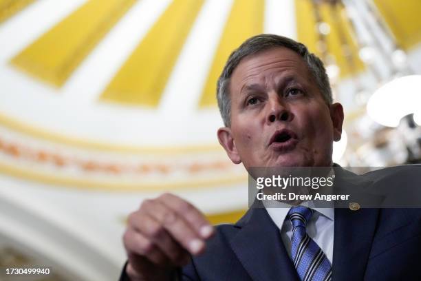 Sen. Steve Daines speaks to reporters following a closed-door lunch meeting with Senate Republicans at the U.S. Capitol October 17, 2023 in...